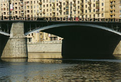 One of the three arches of the Borodino bridge. View from the quay of the river Moscowa.