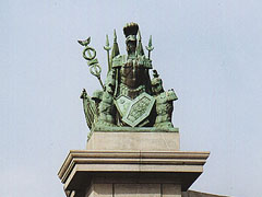 Decorative pyramids of ancient military armours and banners, crowing the colonnade of the Doric Order.